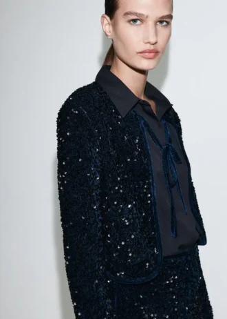 Aksamitna kurtka z cekinami i kokardą